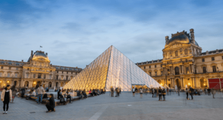 Louvre museum at dusk, Paris France
