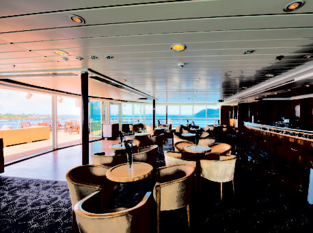 Used for continental breakfast and afternoon tea, this spectacular observation lounge atop the ship is transforms into a nightclub with an indoor/outdoor dance floor.