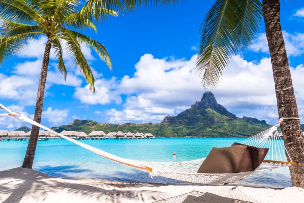 Hammock on a beach on Bora Bora Island, French Polynesia.